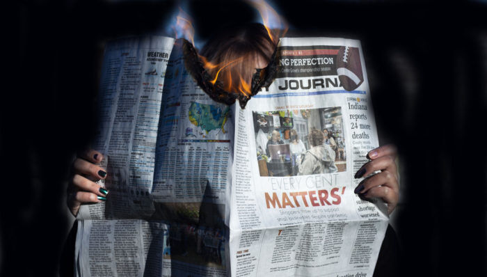 Newspaper on fire